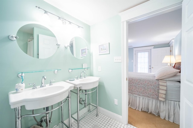 ensuite bathroom featuring connected bathroom and baseboards