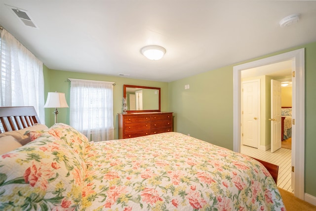 bedroom with carpet floors and visible vents