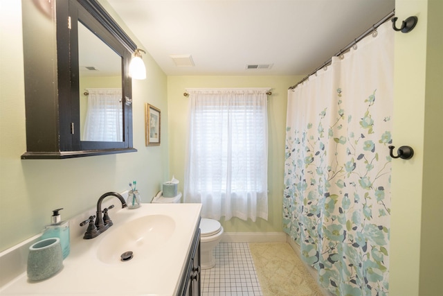 bathroom featuring tile patterned flooring, toilet, a shower with shower curtain, vanity, and visible vents