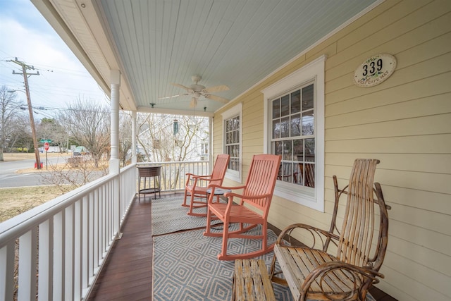 deck featuring a ceiling fan and covered porch