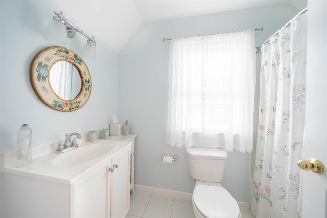 bathroom with tile patterned flooring, toilet, vanity, baseboards, and vaulted ceiling