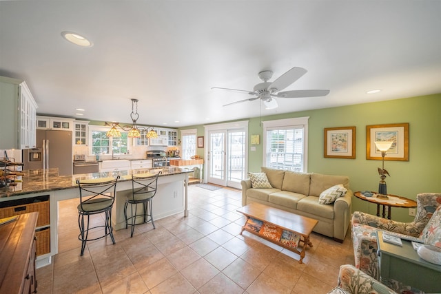 living room with light tile patterned floors, ceiling fan, and recessed lighting