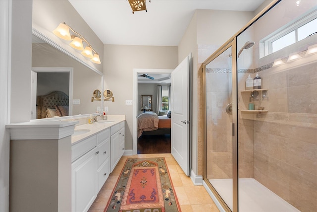 bathroom with vanity, tile patterned floors, walk in shower, and ceiling fan