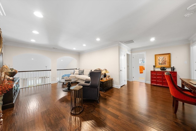 living room with dark hardwood / wood-style flooring and ornamental molding