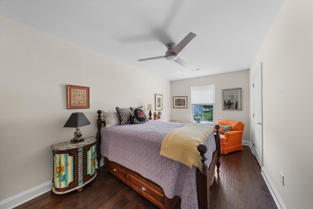 bedroom with ceiling fan and dark hardwood / wood-style flooring