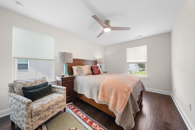 bedroom with ceiling fan and dark hardwood / wood-style floors