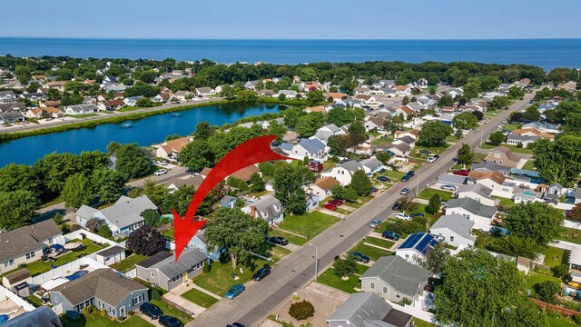 bird's eye view with a residential view and a water view