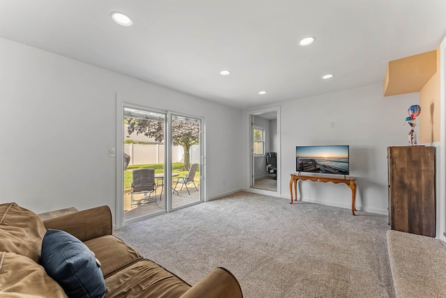 living area with recessed lighting, carpet, and baseboards