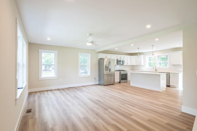 80 W Rising Sun Dr, Ocean View, NJ 08230 - unfurnished living room with light wood-style flooring, a ceiling fan, and recessed lighting