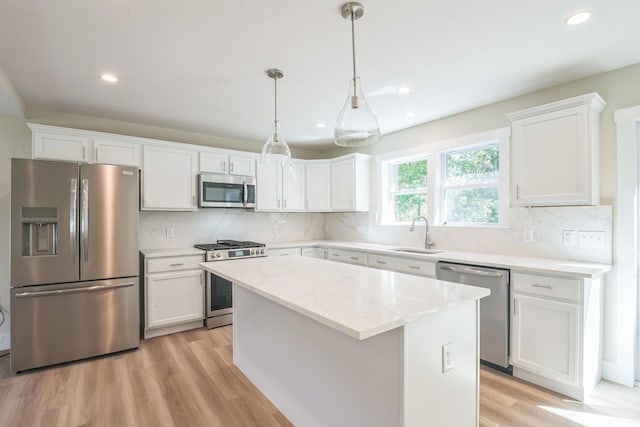 80 W Rising Sun Dr, Ocean View, NJ 08230 - kitchen featuring stainless steel appliances, a center island, white cabinets, tasteful backsplash, and recessed lighting