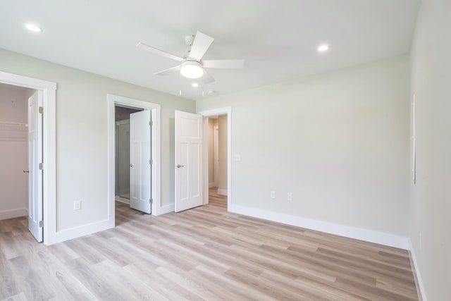 80 W Rising Sun Dr, Ocean View, NJ 08230 - unfurnished bedroom featuring a walk in closet, light wood finished floors, recessed lighting, and a ceiling fan