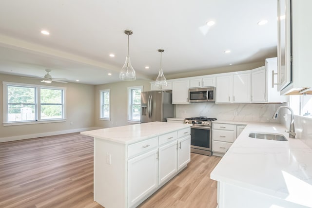 80 W Rising Sun Dr, Ocean View, NJ 08230 - kitchen with stainless steel appliances, plenty of natural light, light wood-style floors, decorative backsplash, and recessed lighting