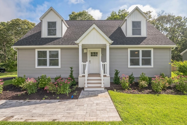 80 W Rising Sun Dr, Ocean View, NJ 08230 - cape cod-style house featuring a shingled roof, a front yard, and board and batten siding