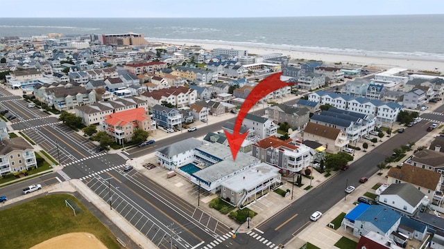 aerial view featuring a water view and a view of the beach