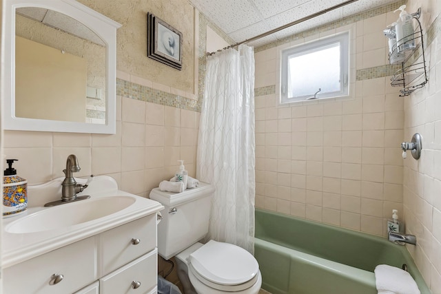 full bathroom featuring vanity, decorative backsplash, toilet, tile walls, and shower / tub combo