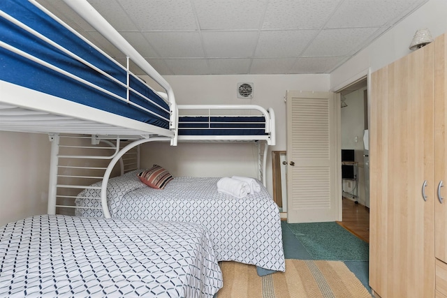 bedroom with a paneled ceiling