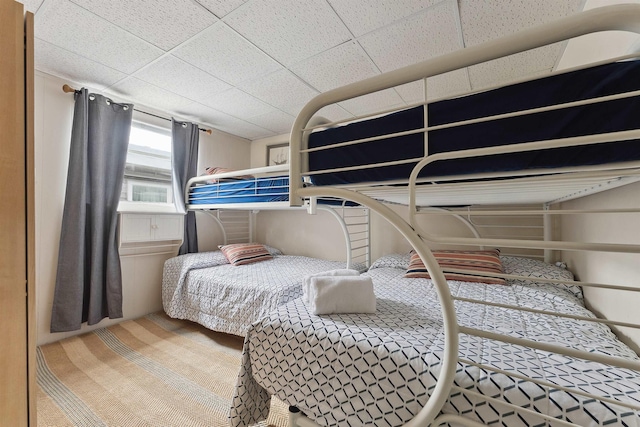 bedroom featuring a paneled ceiling