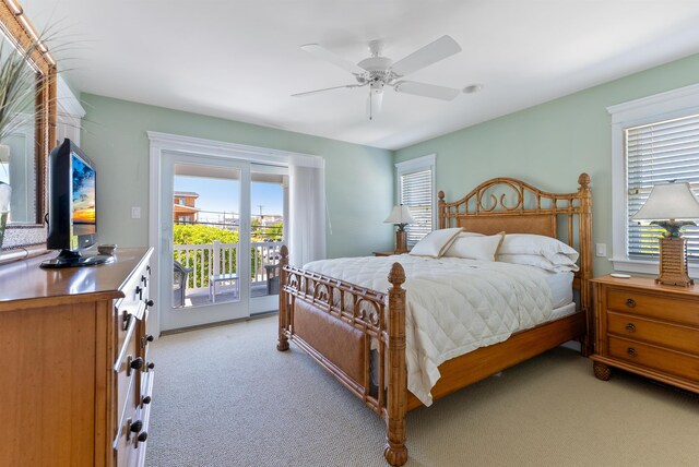 bedroom featuring access to exterior, light carpet, and ceiling fan