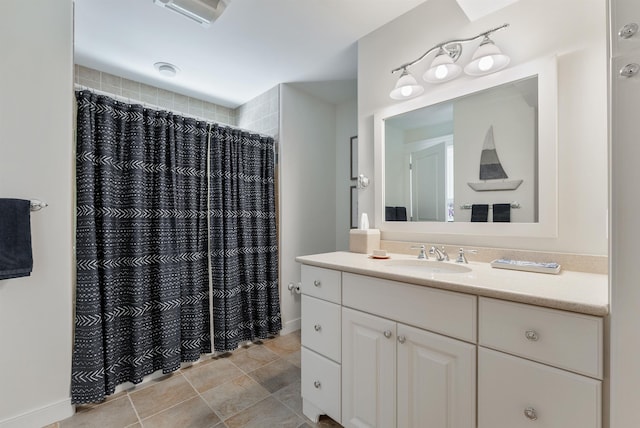 bathroom with vanity and curtained shower