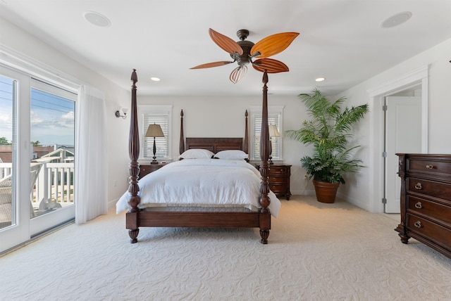 bedroom featuring access to exterior, light colored carpet, and ceiling fan