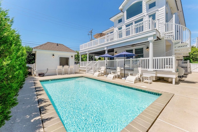 view of swimming pool with a patio