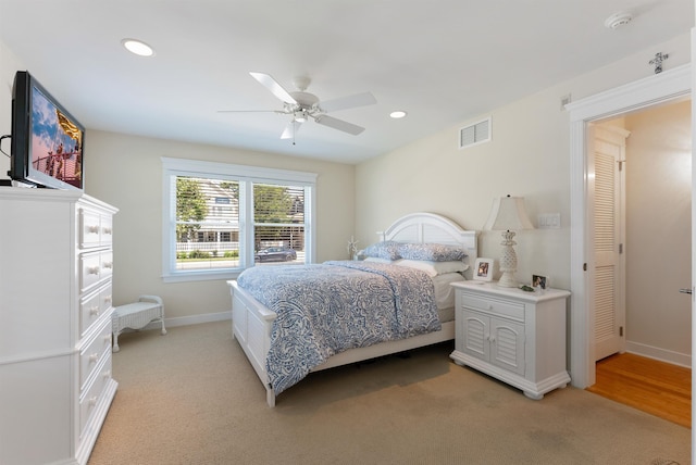 carpeted bedroom with ceiling fan