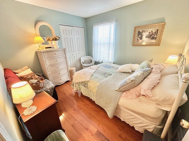 bedroom featuring a closet and wood finished floors