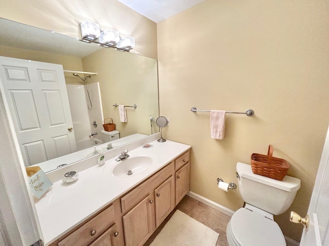 bathroom with vanity, toilet, bathtub / shower combination, and baseboards