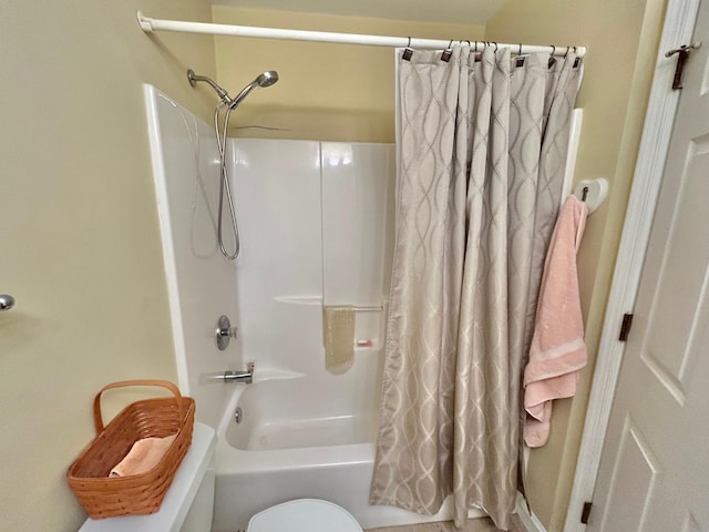 bathroom with toilet and shower / tub combo with curtain