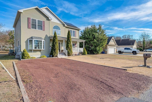 view of front of property with a porch and driveway