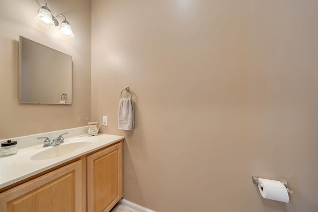 bathroom featuring vanity and baseboards