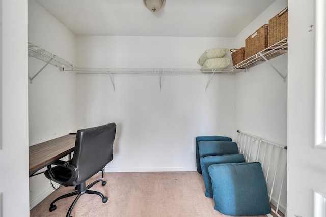 carpeted office featuring baseboards