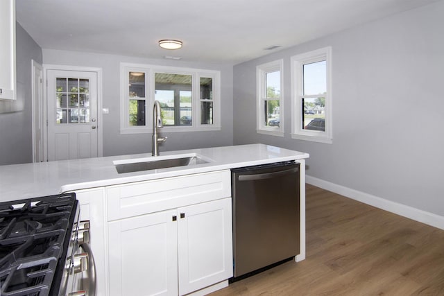 30 Pinetree Dr, Villas, NJ 08251 - kitchen featuring stainless steel appliances, a sink, white cabinets, and light countertops