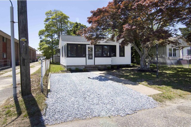 30 Pinetree Dr, Villas, NJ 08251 - view of front facade with a sunroom and fence