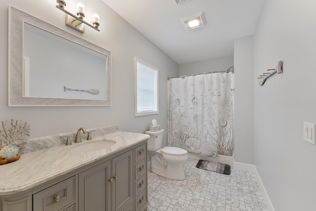 bathroom with curtained shower, toilet, vanity, baseboards, and tile patterned floors