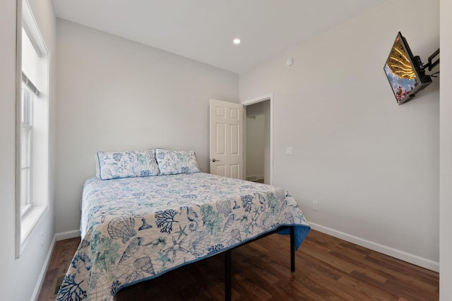 bedroom with recessed lighting, baseboards, and wood finished floors