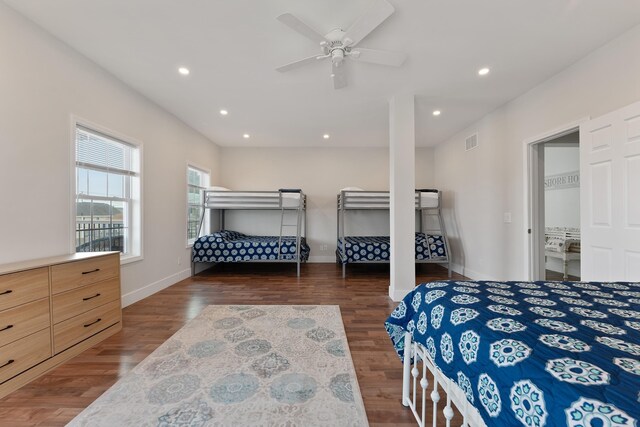 bedroom featuring recessed lighting, visible vents, baseboards, and wood finished floors