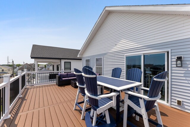 deck with outdoor dining space