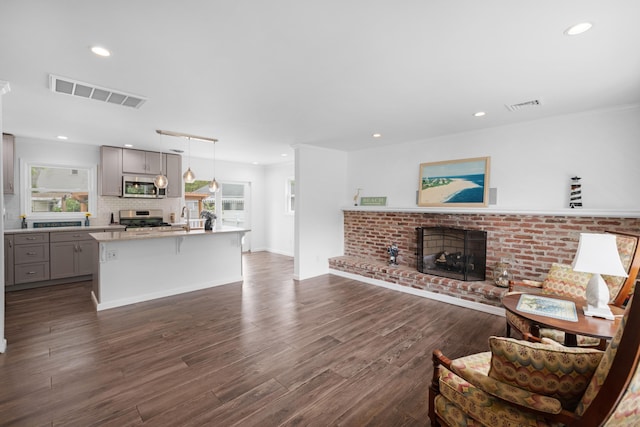 121 Roslyn Ave, North Cape May, NJ 08204 - living area featuring a fireplace, dark wood finished floors, and recessed lighting