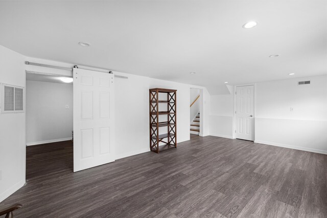 121 Roslyn Ave, North Cape May, NJ 08204 - empty room with dark wood-style flooring, recessed lighting, stairway, and a heating unit