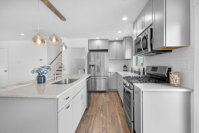 121 Roslyn Ave, North Cape May, NJ 08204 - kitchen featuring appliances with stainless steel finishes, gray cabinets, wood finished floors, tasteful backsplash, and recessed lighting