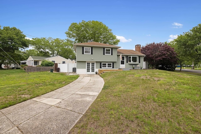 121 Roslyn Ave, North Cape May, NJ 08204 - split level home with french doors, a chimney, and driveway