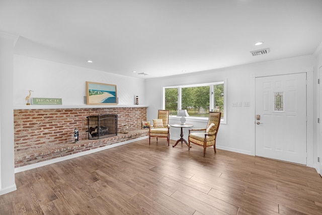 121 Roslyn Ave, North Cape May, NJ 08204 - living area featuring ornamental molding, a fireplace, wood finished floors, and recessed lighting
