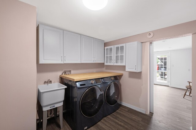 121 Roslyn Ave, North Cape May, NJ 08204 - laundry area with independent washer and dryer, cabinet space, and dark wood-style floors