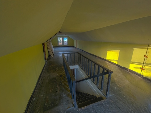 staircase featuring lofted ceiling