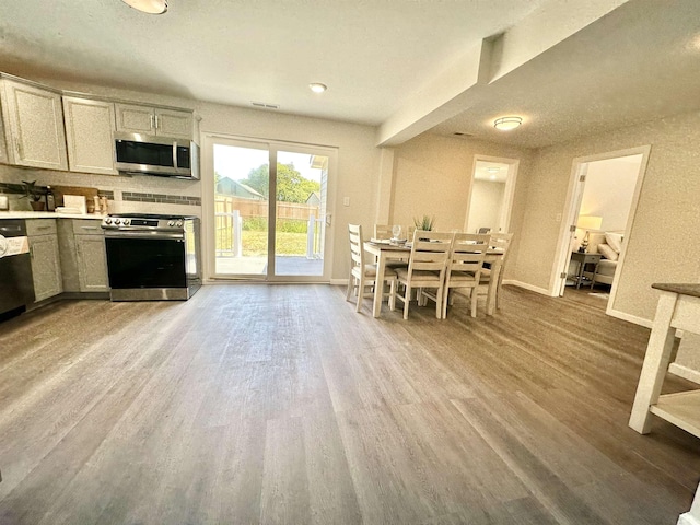 dining area featuring hardwood / wood-style flooring