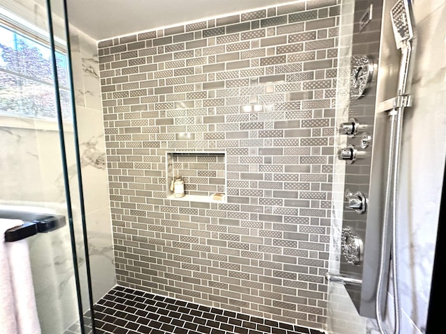 bathroom featuring an enclosed shower