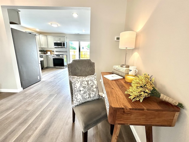 dining area featuring light wood-type flooring