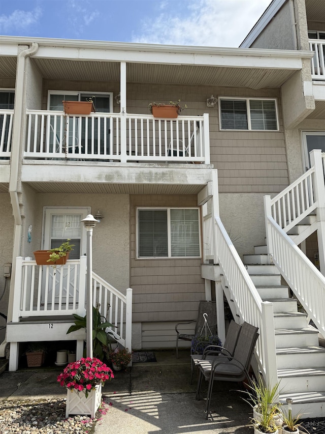 rear view of house with a balcony