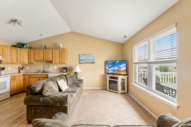 328 E 25th Ave Unit C, North Wildwood, NJ 08260 - living room featuring vaulted ceiling and baseboards